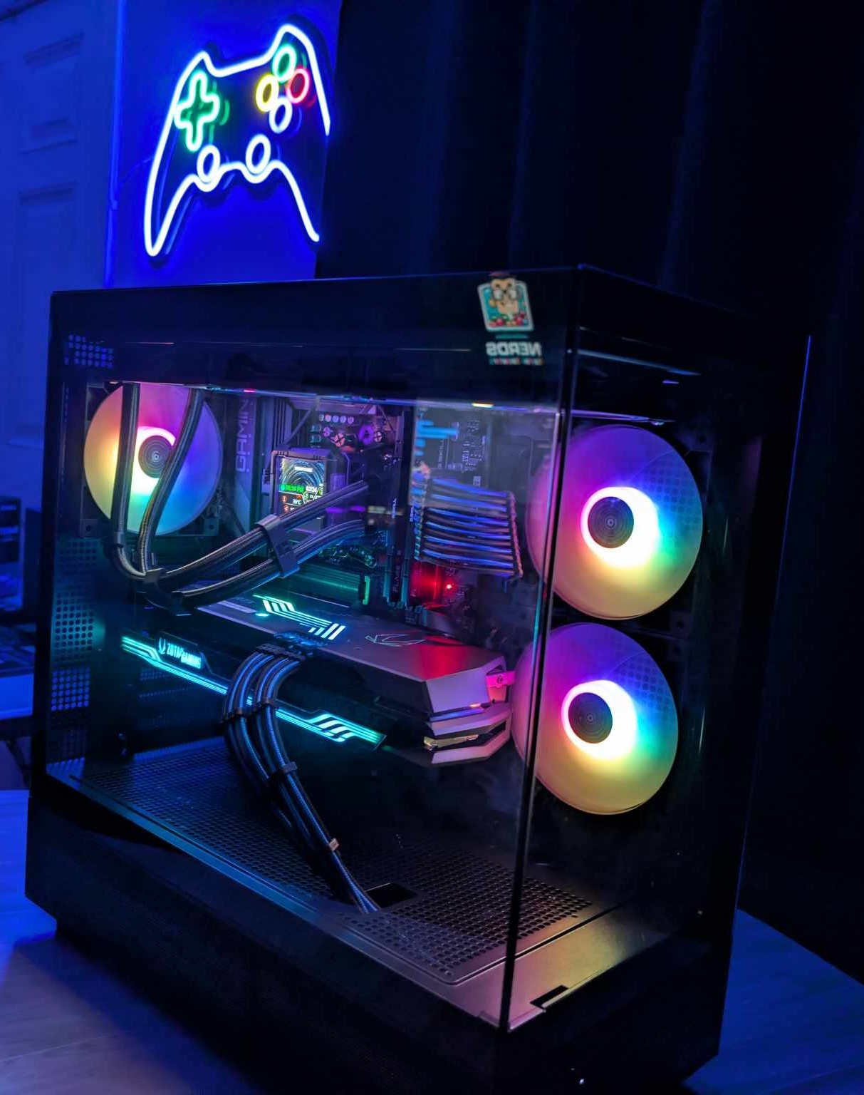 Custom PC build interior with purple and blue RGB fan lighting
