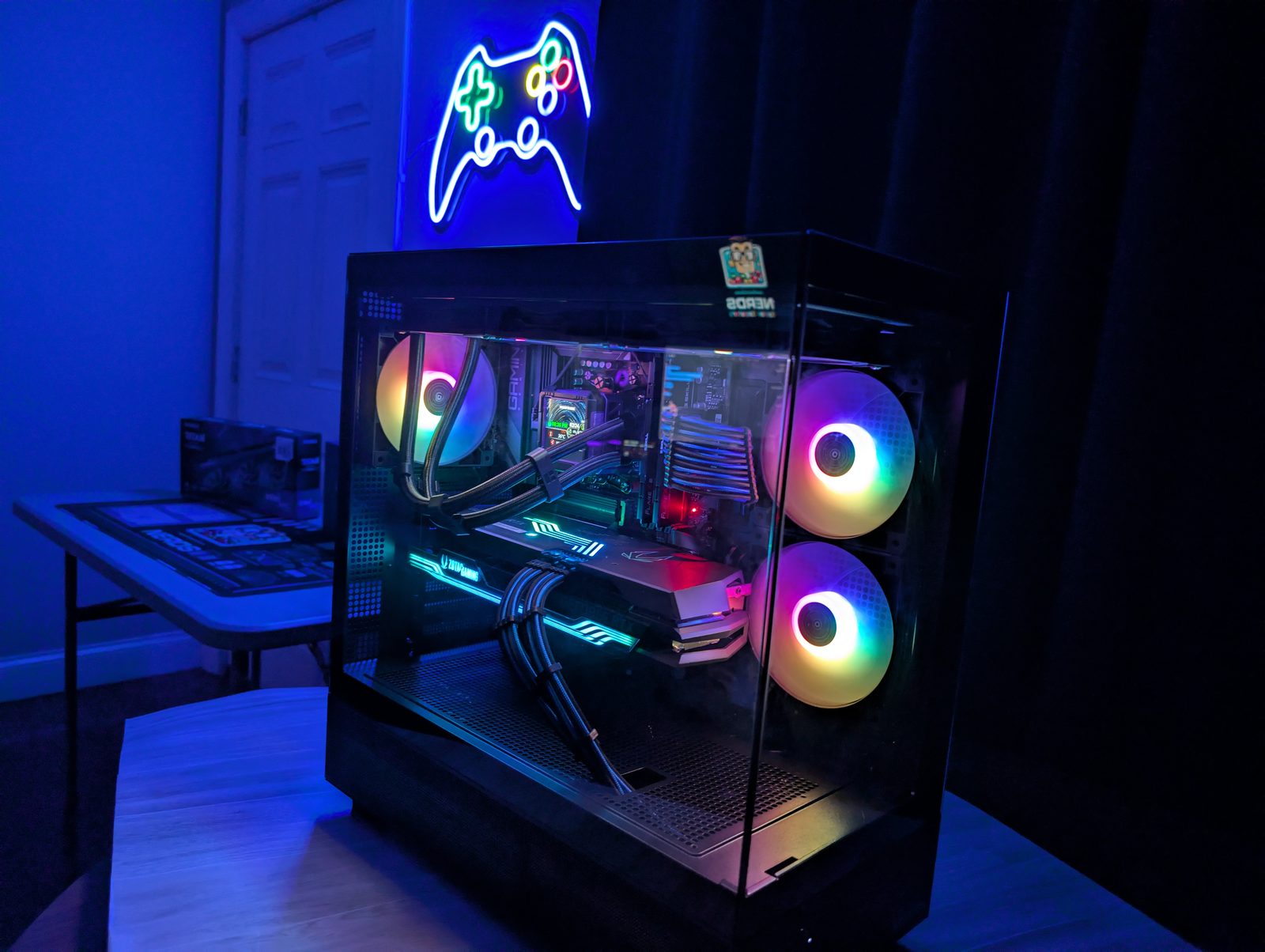 Custom PC build with RTX 4080 graphics card and teal RGB lighting